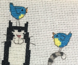 Cross stitching cats