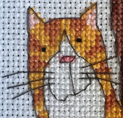 Cat stack cross stitch using French knots