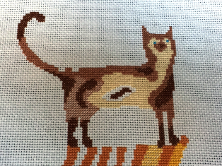 Image Showing incomplete stitching. Where to get a Cat Stack cross stitch kit.