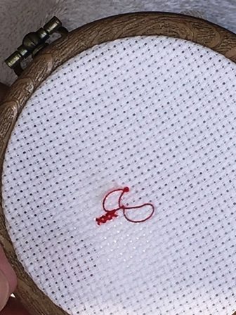French Knots in cross stitch.