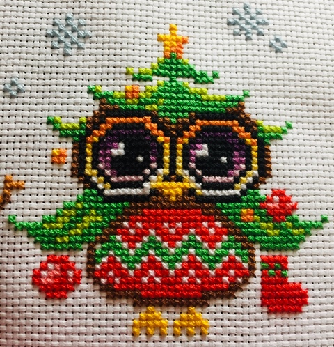 Christmas tree cross stitching owl with stockings, baubles and a star.
Christmas Owls Cross-stitching project